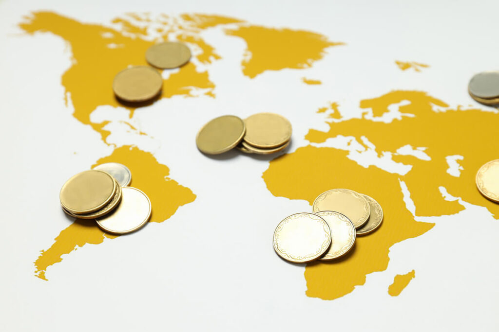 World map and financial icons representing the OECD G20 Inclusive Framework and global tax reform