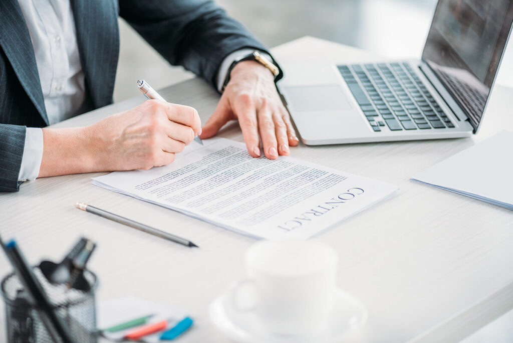 Illustration of professionals reviewing documents related to BVI Beneficial Ownership regime